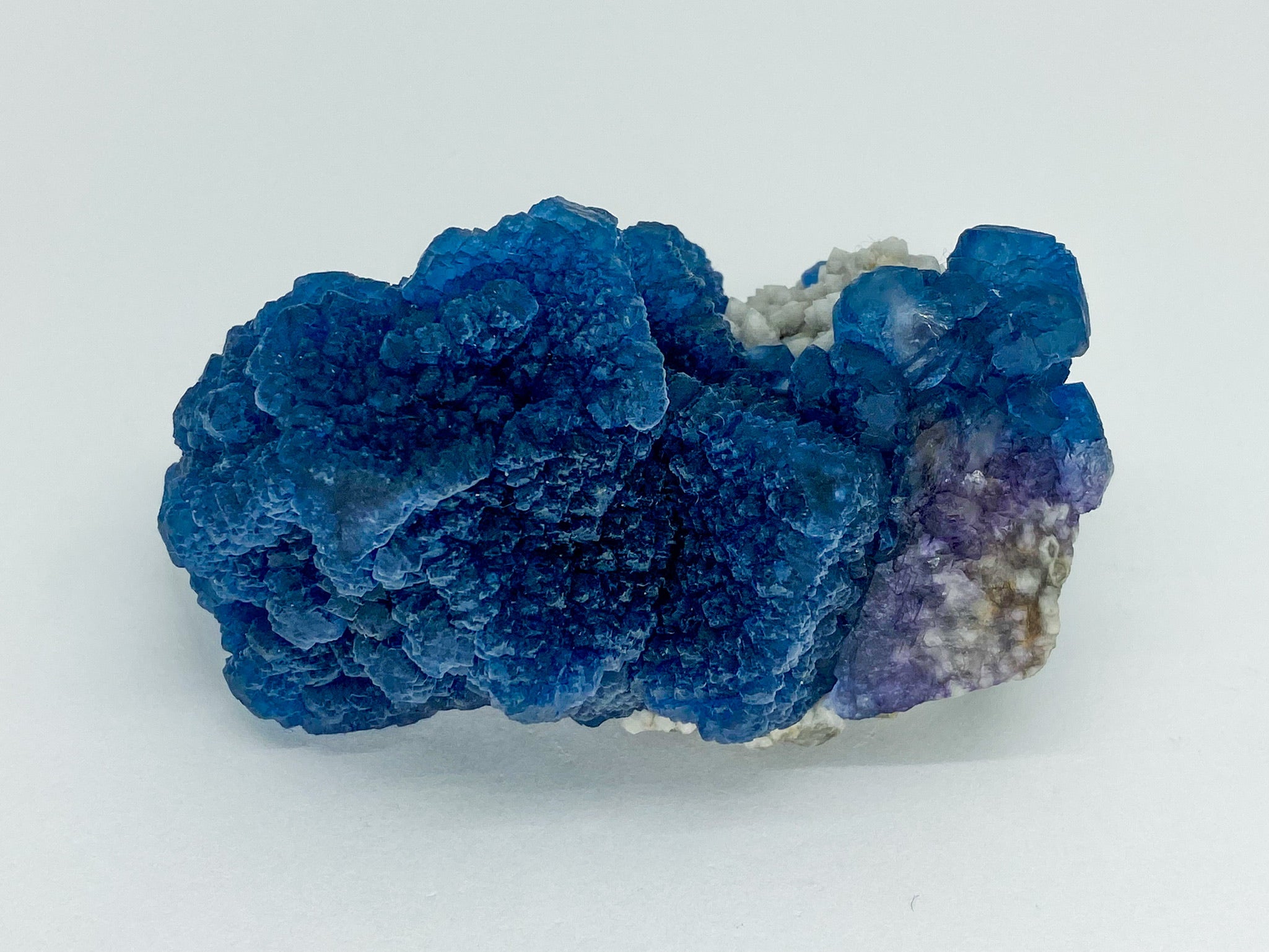 Blue Step Fluorite on Candle Quartz