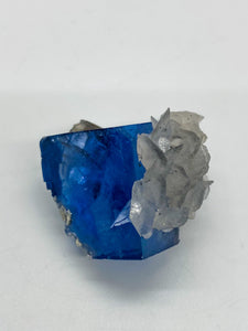 Blue Fluorite cube with calcite flower